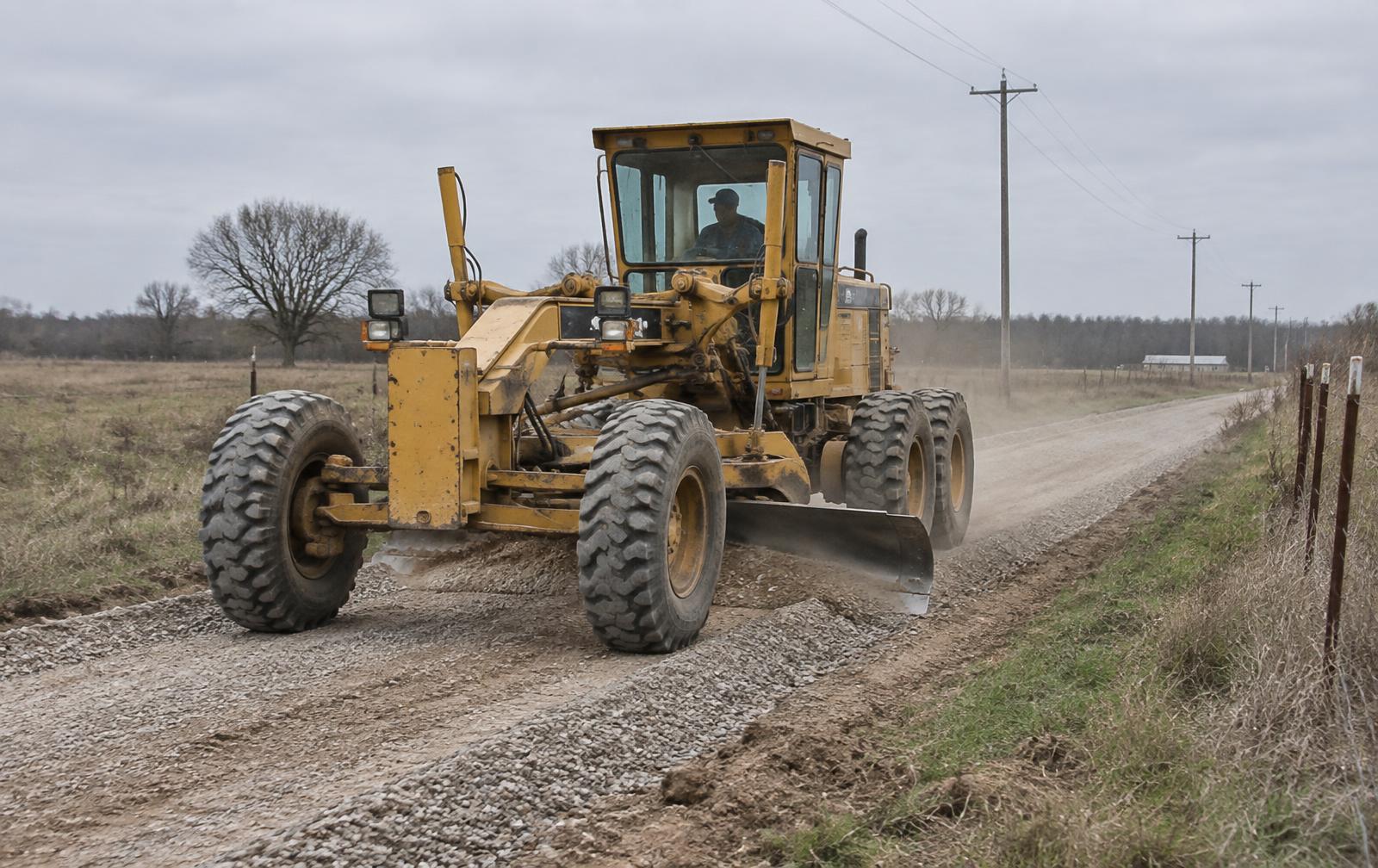 Motor grader building a rural Oklahoma driveway